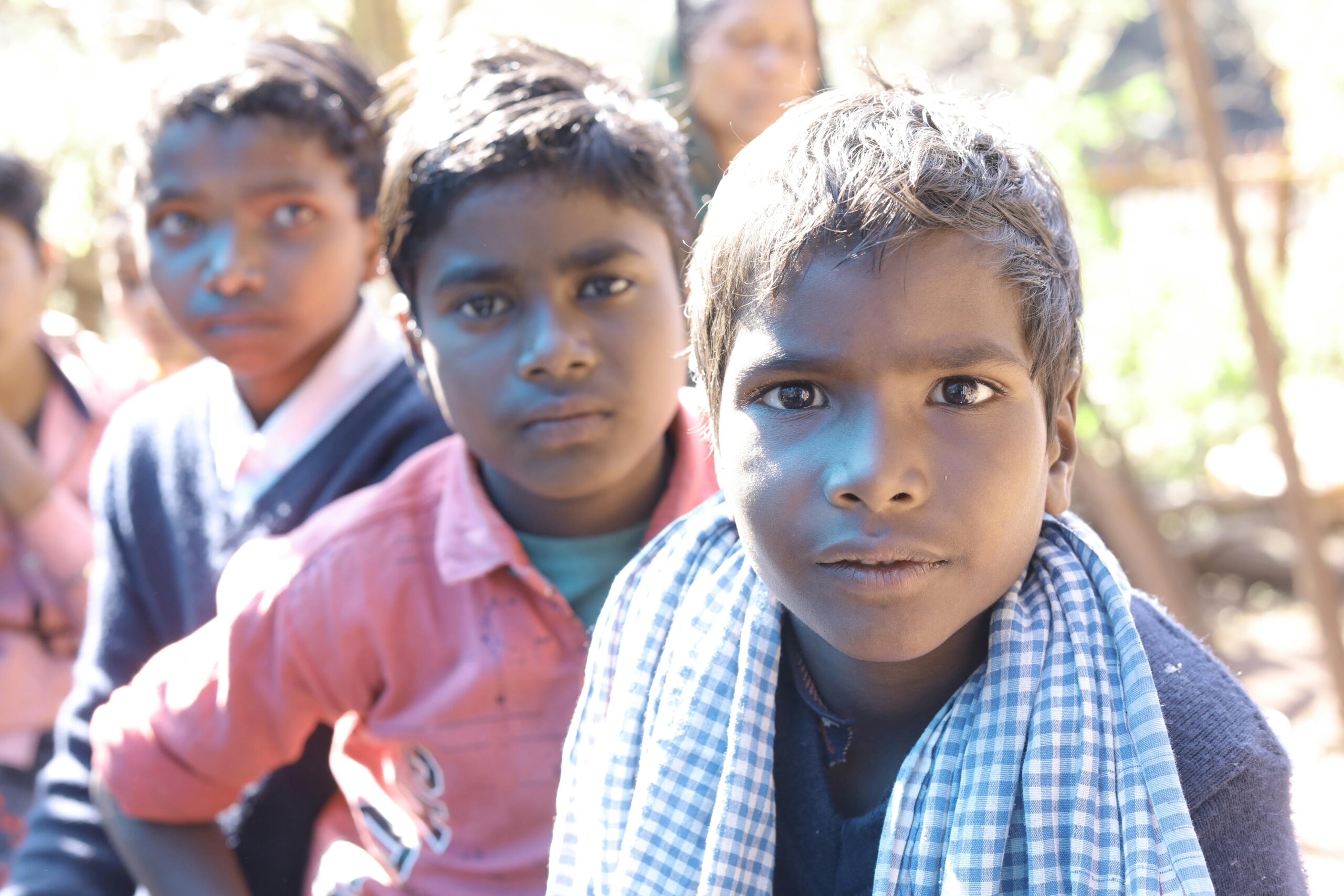 Home Close-up portrait of Indian children outdoors in Amarkantak, MP, India, under natural light.